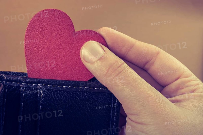 Brown leather wallet in hand saving and finance concept,