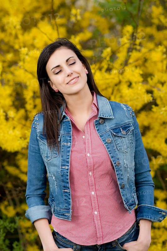 Young woman in front of golden rain,