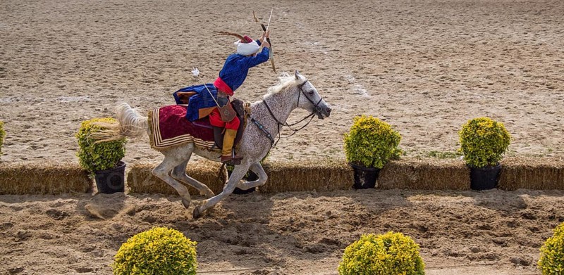 Ottoman archer riding and shooting on horseback,