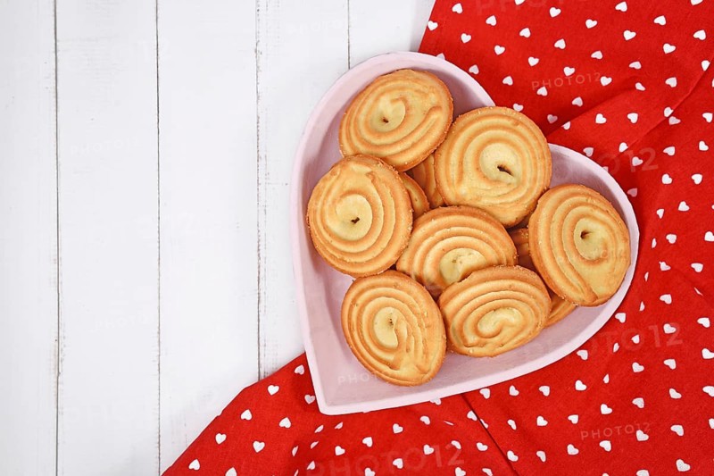 Round ring shaped spritz biscuits called 'Spritzgeback', a type of German butter cookies