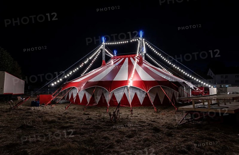 Small red illuminated circus tent at night, Rutesheim