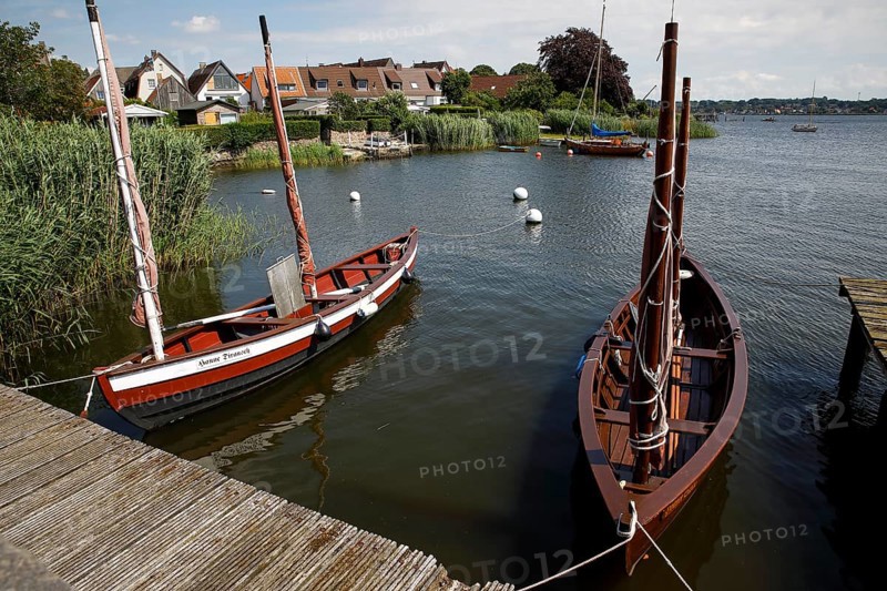 Wooden boats on the Schlei in front of the historic fishing village of Holm, Schleswig