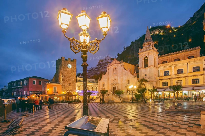 Belvedere Piazza IX Aprile with clock tower and church of San Giuseppe at dusk, Taormina
