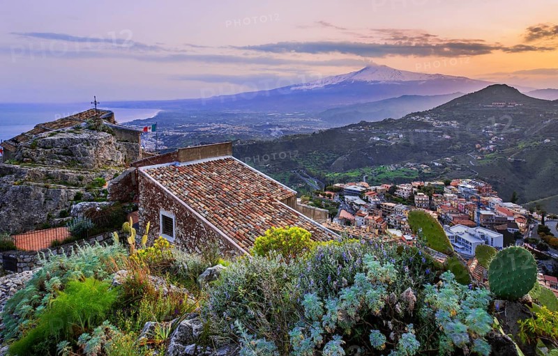 Chapel Madonna della Rocca above the village with Etna 3357m at dusk, Taormina
