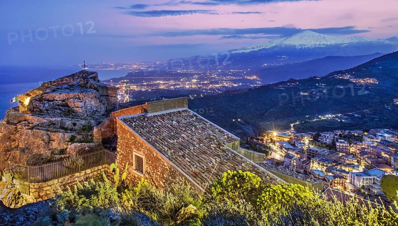 Chapel Madonna della Rocca above the village with Etna 3357m at dusk, Taormina