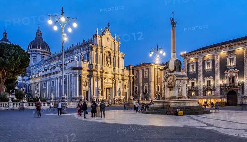 Cathedral square with cathedral and elephant fountain in the old town at dusk, Catania