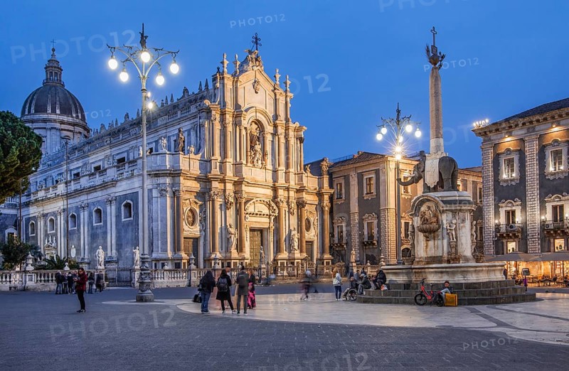 Cathedral square with cathedral and elephant fountain in the old town at dusk, Catania