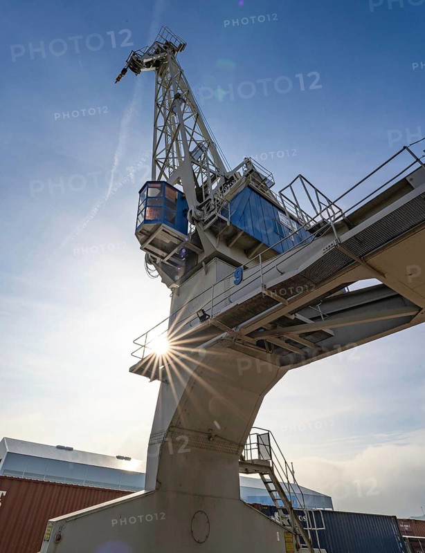 Loading crane with sun star in the port of Karlsruhe, Germany