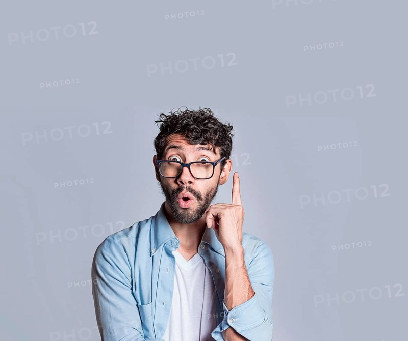 Amazed person pointing an advertisement up, Amazed people pointing with a hand up