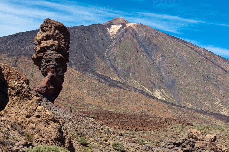 View of flank and summit of volcano Teide highest mountain of Spain, left foreground lava formation Devil's Finger