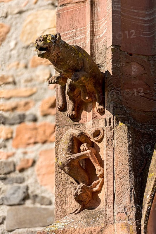 Medieval mythical creatures, gargoyles on the portal of the porch
