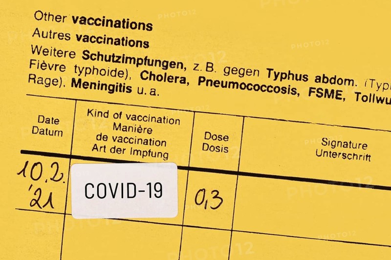 Certificate of vaccination with COVID-19 vaccine sticker,