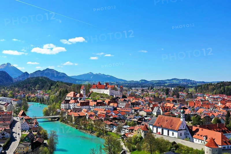 Aerial view of Fuessen with a view of the Lech river, the Benedictine monastery of St. Mang and the high castle. Ostallgaeu Swabia