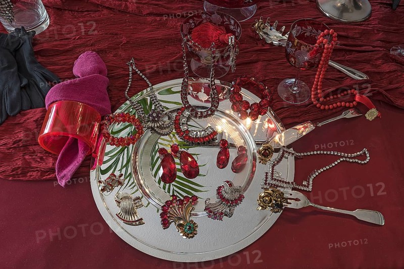 Rhinestone jewellery and accessories decorated on a silver plate and red cloth, Bavaria