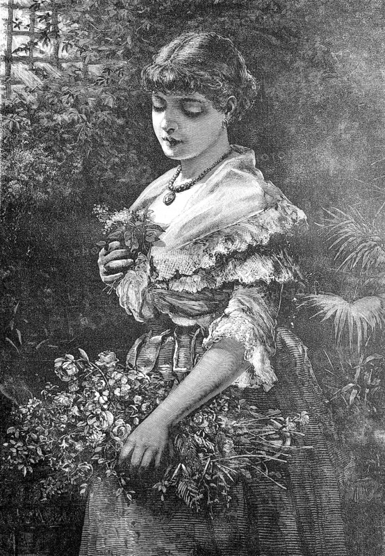 Young woman in alpine traditional costume decorated with many flowers stands in park waiting for her lover, austria