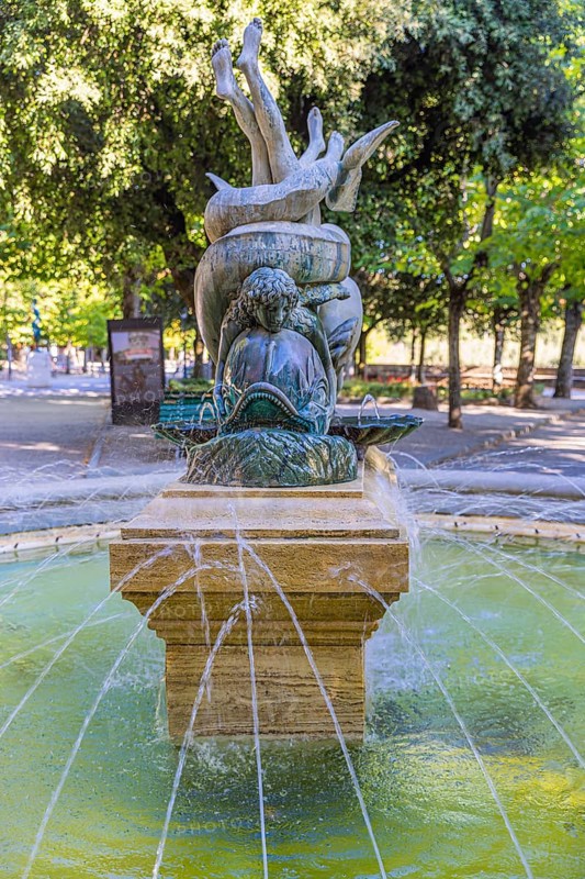 Dolphin fountain in the public municipal park, Cortona