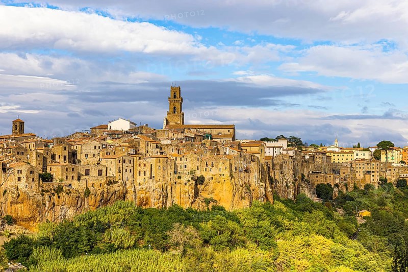 Panoramic view of the medieval town of Pitigliano, dark clouds above