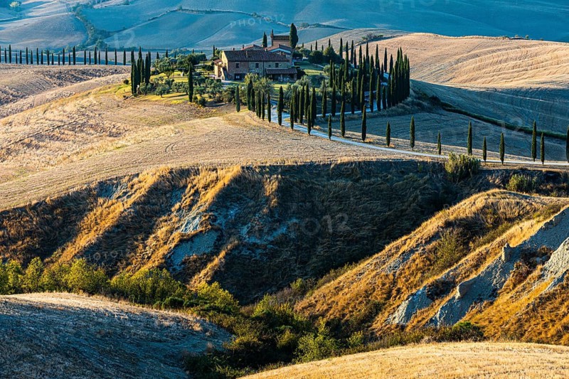 The country house Baccoleno on hills of the Crete Senesi in the evening light, near Asciano