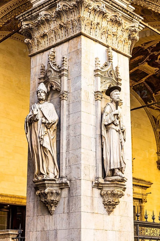 Stone figures on a support in the historic centre, Siena