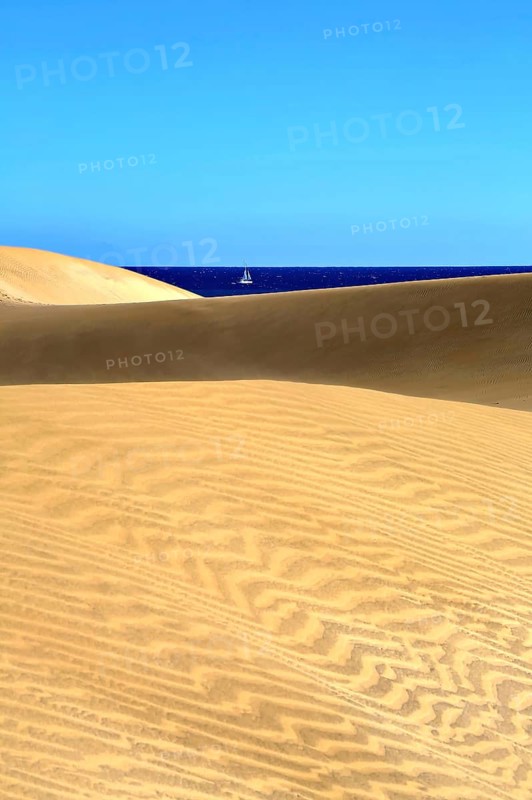 The dunes of Playa Del Ingles with a view of the Atlantic Ocean. San Bartolome de Tirajana, Gran Canaria