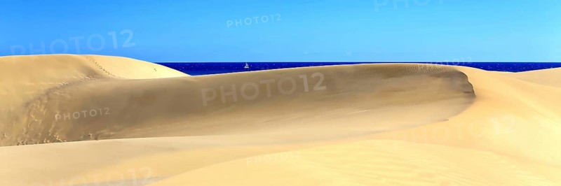 The dunes of Playa Del Ingles with a view of the Atlantic Ocean. San Bartolome de Tirajana, Gran Canaria