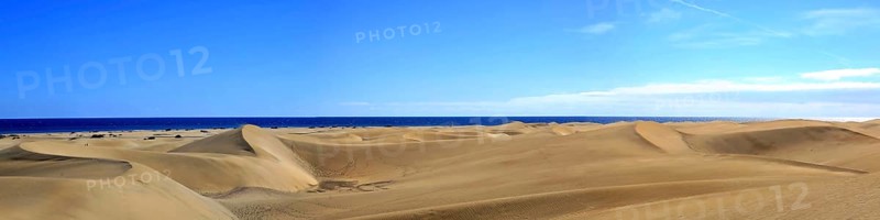 The dunes of Playa Del Ingles with a view of the Atlantic Ocean. San Bartolome de Tirajana, Gran Canaria