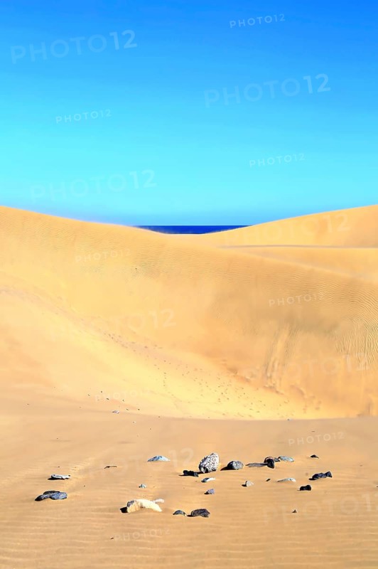 The dunes of Playa Del Ingles with a view of the Atlantic Ocean. San Bartolome de Tirajana, Gran Canaria