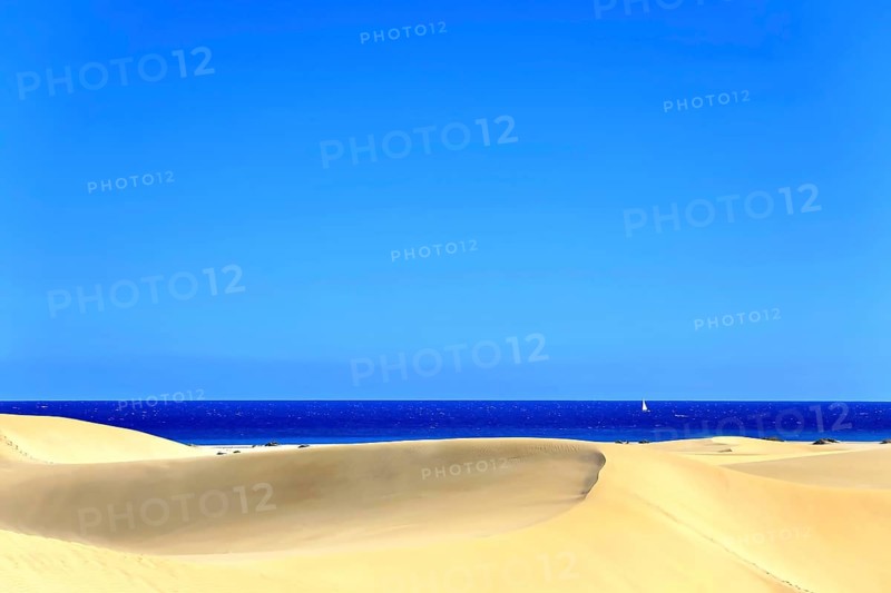 The dunes of Playa Del Ingles with a view of the Atlantic Ocean. San Bartolome de Tirajana, Gran Canaria