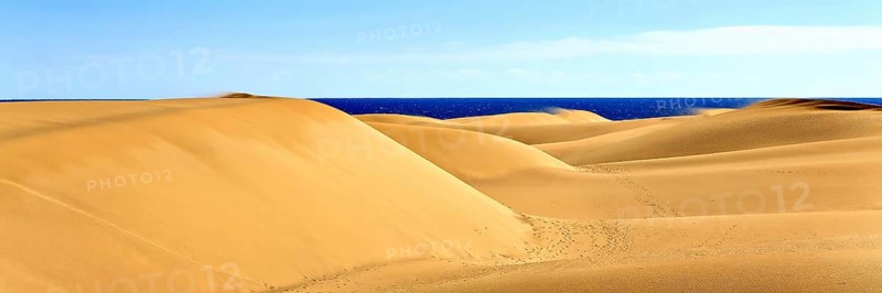 The dunes of Playa Del Ingles with a view of the Atlantic Ocean. San Bartolome de Tirajana, Gran Canaria
