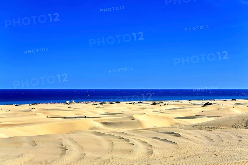 The dunes of Playa Del Ingles with a view of the Atlantic Ocean. San Bartolome de Tirajana, Gran Canaria