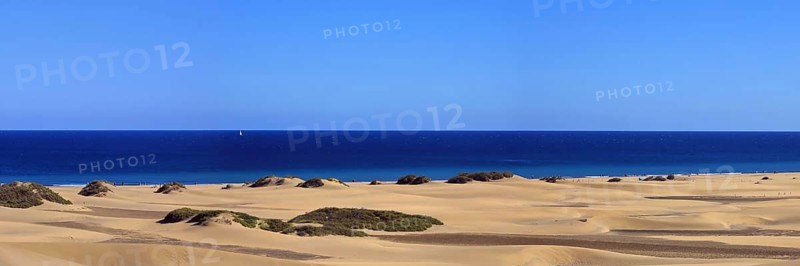 The dunes of Playa Del Ingles with a view of the Atlantic Ocean. San Bartolome de Tirajana, Gran Canaria