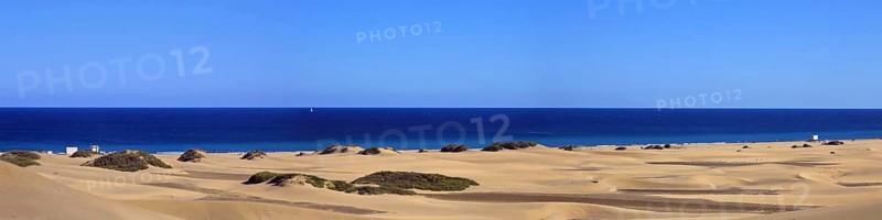 The dunes of Playa Del Ingles with a view of the Atlantic Ocean. San Bartolome de Tirajana, Gran Canaria