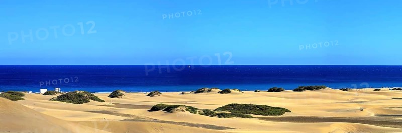 The dunes of Playa Del Ingles with a view of the Atlantic Ocean. San Bartolome de Tirajana, Gran Canaria