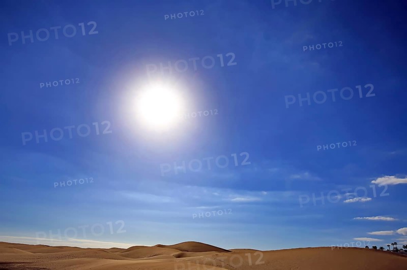The dunes of Playa Del Ingles with a view of the sun. San Bartolome de Tirajana, Gran Canaria