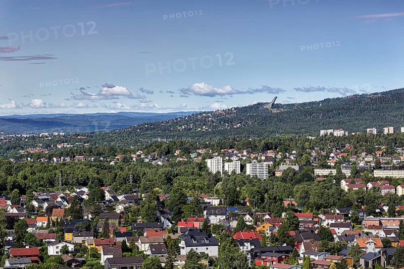 View from Grefsenkollen of houses and wooded areas, view of the city and Mount Holmenkollen with ski jump