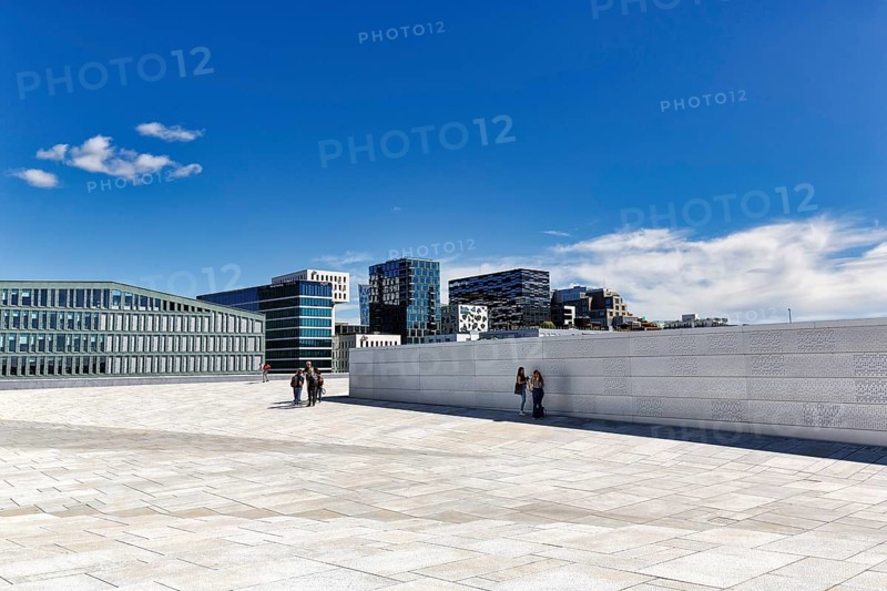 Pedestrians on the white roof of the opera house, modern architecture