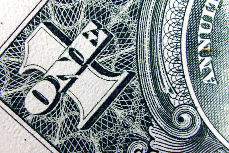Macro of one dollar note greatly enlarged,