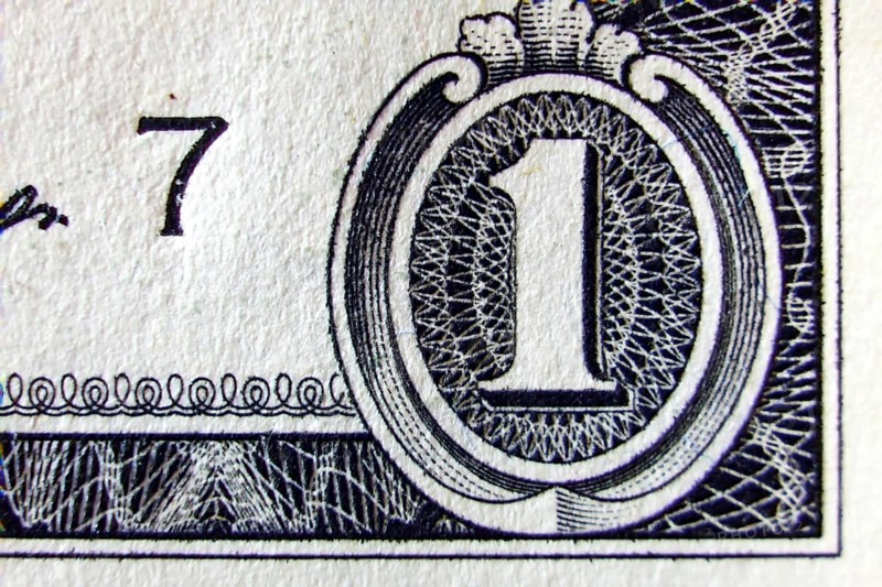 Macro of one dollar note greatly enlarged,