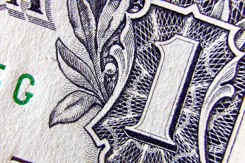 Macro of one dollar note greatly enlarged,