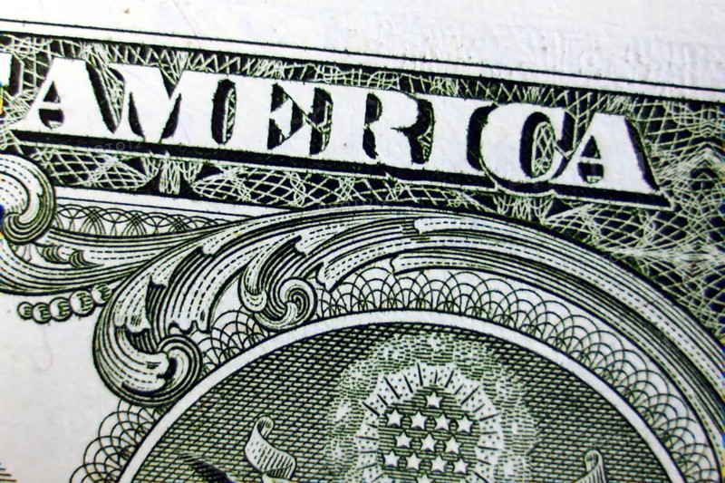 Macro of one dollar note greatly enlarged,