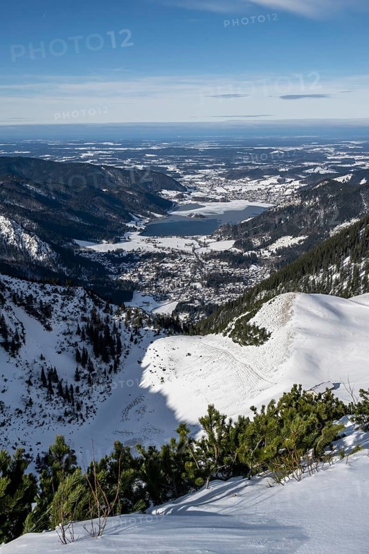 View from the top of the Jagerkamp to Schliersee and village, mountains in winter