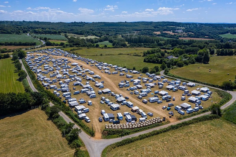 Aerial view of Gens de Voyage or Travelling People camp set up without permission in a field in Dirinon, Finistere Penn-ar-Bed department