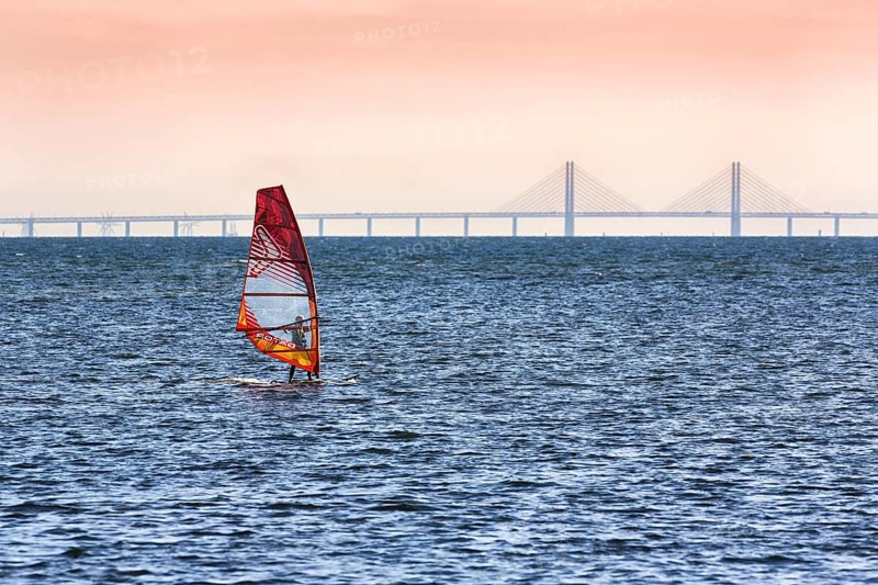 Windsurfers in front of the Oeresund Bridge, Oresundsbroen between Malmoe and Copenhagen