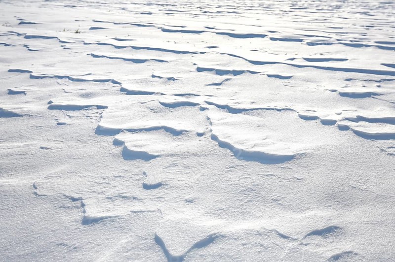 Snow drifts caused by wind from powder snow look like dunes and form bizarre patterns and structures,