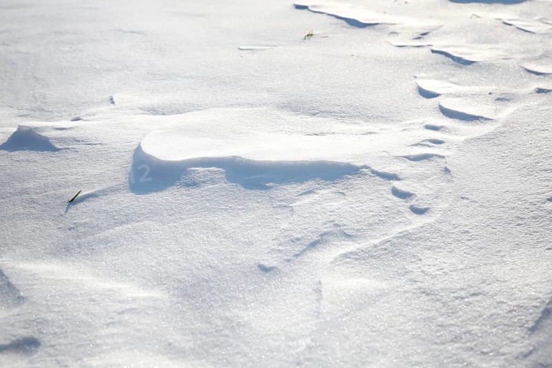 Snow drifts caused by wind from powder snow look like dunes and form bizarre patterns and structures,