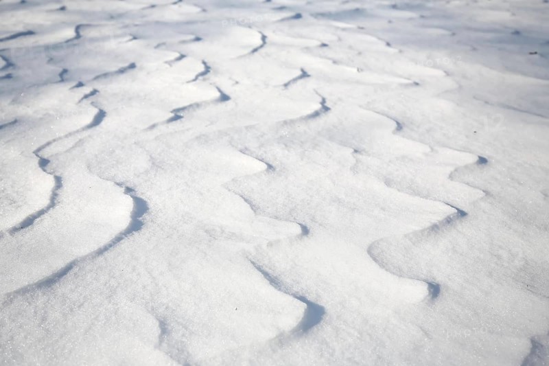 Snow drifts caused by wind from powder snow look like dunes and form bizarre patterns and structures,