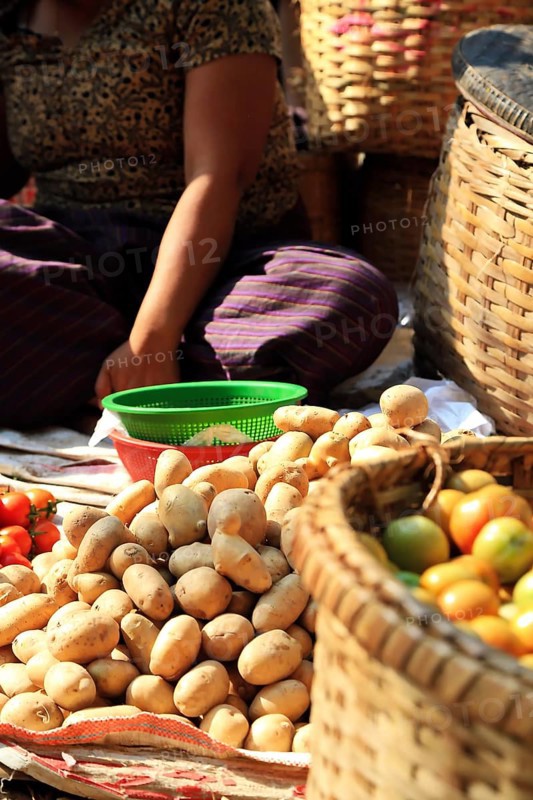Vegetable vendor at Mani Sithu Market. Nyaung-U, Myanmar