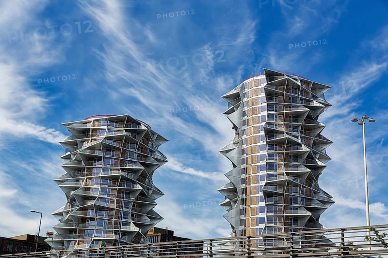 Two dramatically shaped residential towers, high-rises side by side