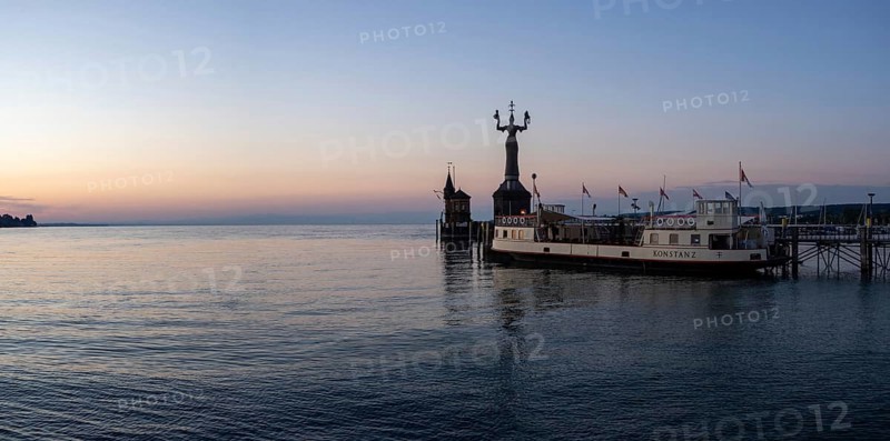 Morning light in the harbour of Constance with Imperia and and the historic ferry Constance, Constance