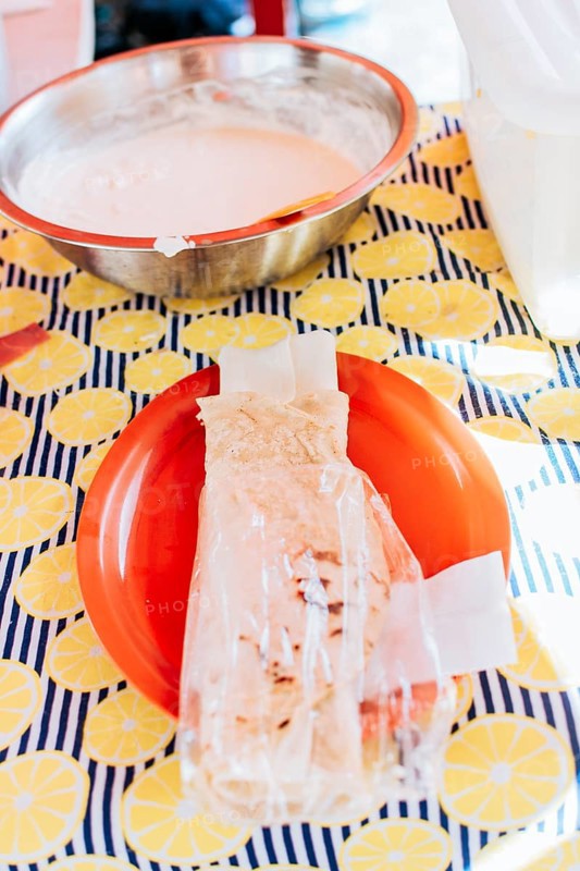 Traditional Nicaraguan Quesillo, food Traditional Large Quesillo served on table. Nicaraguan cheese made and served on the table. Traditional cheese with pickled onion and wrapped tortilla